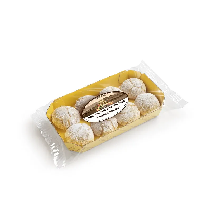 A clear plastic tray filled with round, powdered pastries. Italian biscuits amaretti. Hand made Italian cookies australia