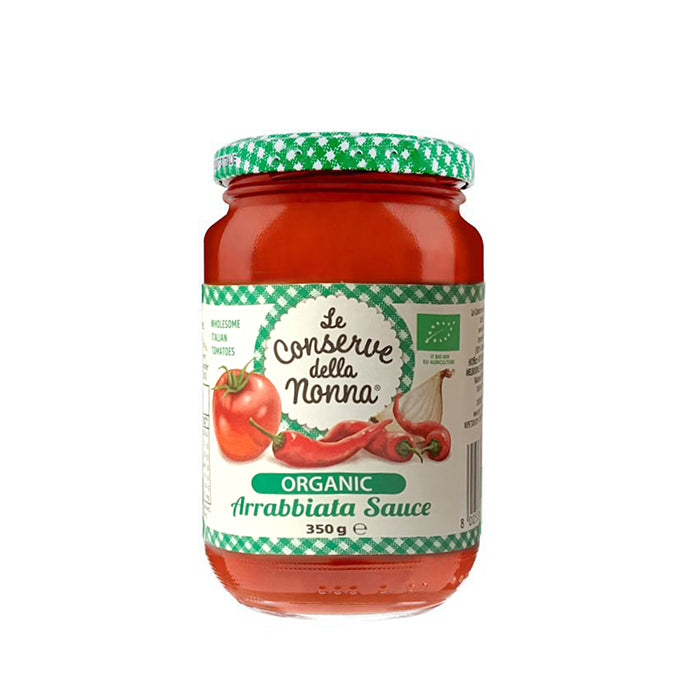Jar of organic arrabbiata sauce with a green and white label on a white background
