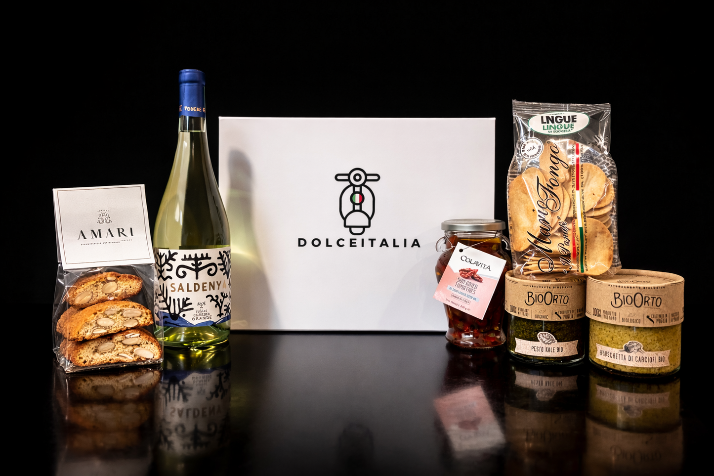 Dolceitalia gift box with a bottle of wine, cookies, and various food items on a black background. italian food hampers