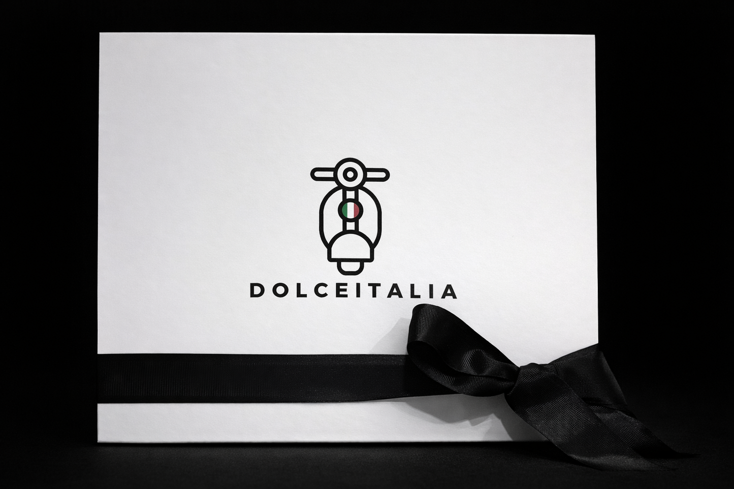 White box with Dolceitalia logo and black ribbon on a black background