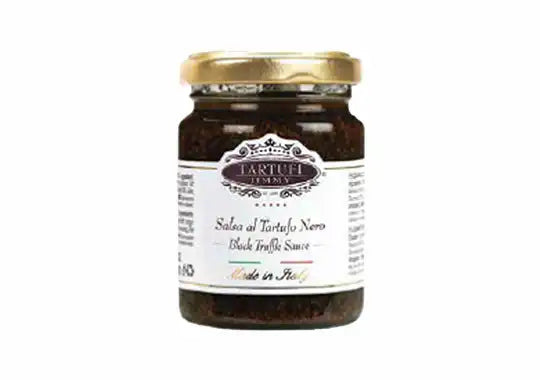 Jar of black truffle sauce with a visible label on a white background