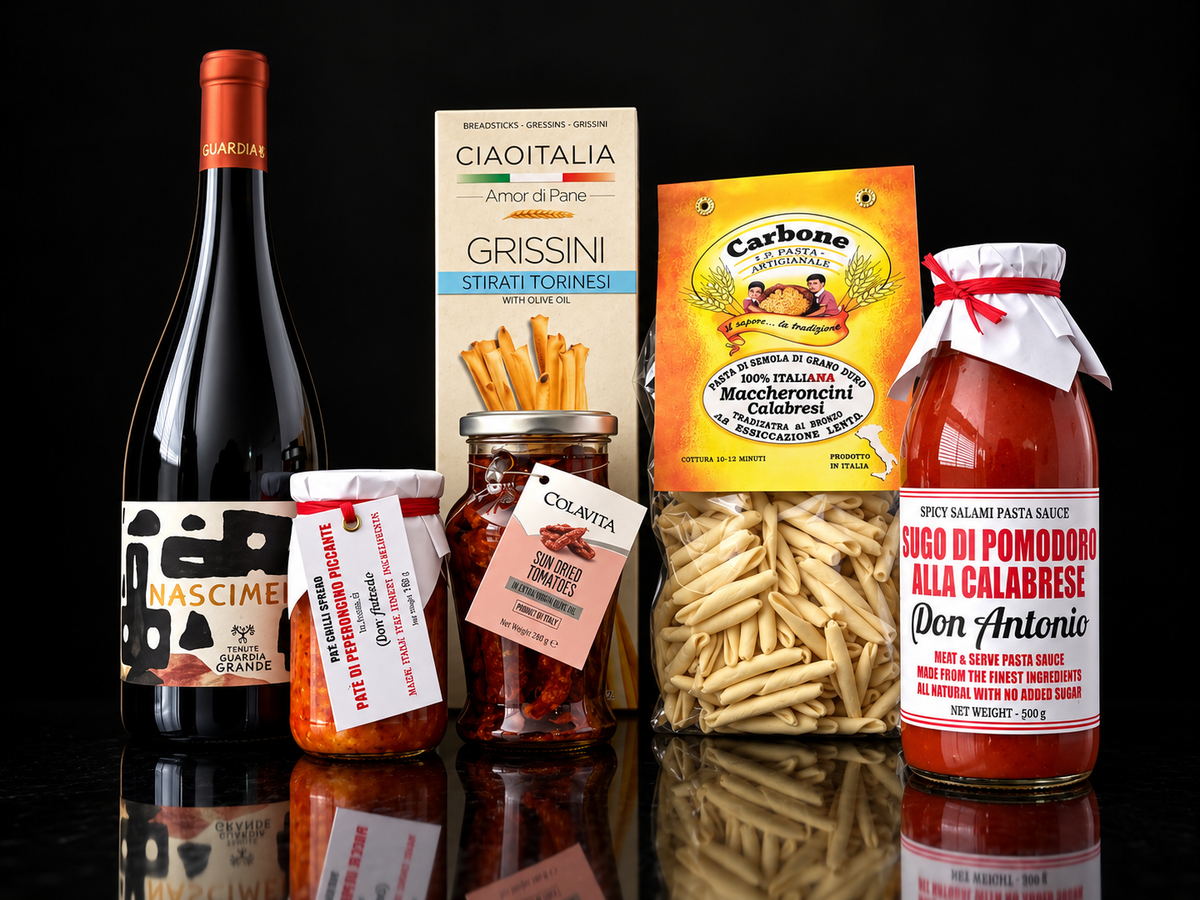 Italian hamper with cannonau wine, pasta sauce and spread. Italian gifts basket 