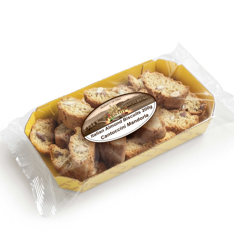A package of Italian almond biscuits (Cantuccini Mandorli) in a clear plastic tray with a yellow interior, featuring a round label in the center. Italian cantucci cookies