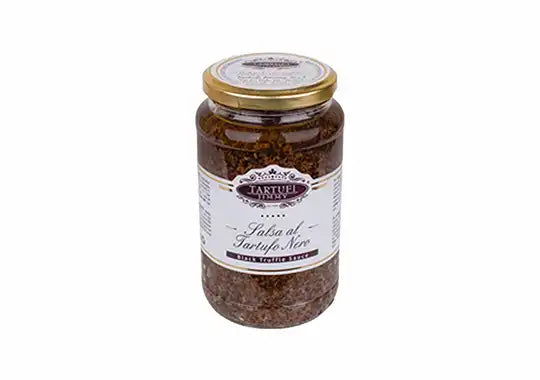 Jar of black truffle sauce with a visible label on a white background