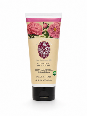 Tube of body lotion with floral design on a white background. Italian body lotion