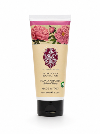 Tube of body lotion with floral design on a white background. Italian body lotion
