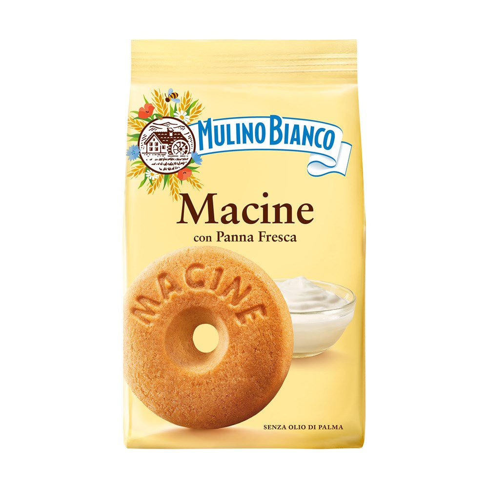 Yellow package of Mulino Bianco Macine cookies with a cookie and cream on a white background